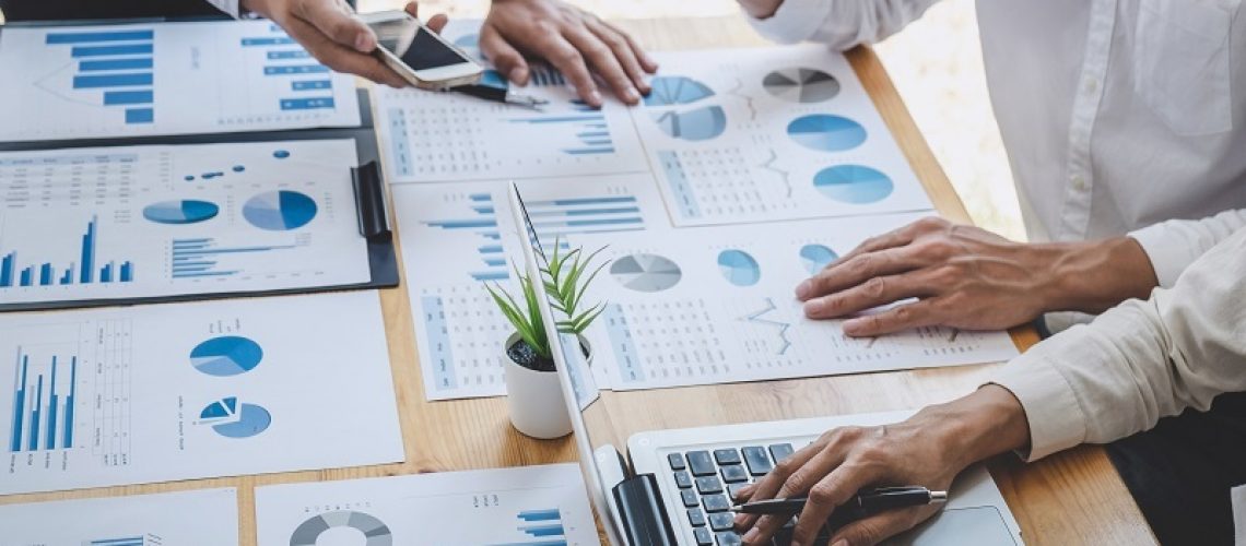 Business casual team manager having a discussion with new project success financial statistics, Partner meeting professional investor working start up project for both company with document.